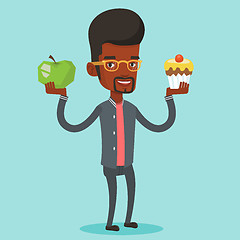 Image showing Man choosing between apple and cupcake.