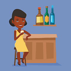 Image showing Woman sitting at the bar counter.