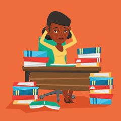 Image showing Student sitting at the table with piles of books.