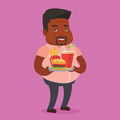 Image showing Man holding tray full of fast food.
