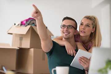 Image showing Young couple moving in a new home