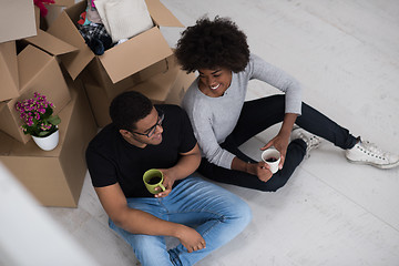 Image showing African American couple relaxing in new house