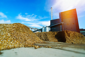 Image showing bio power plant with storage of wooden fuel (biomass) against bl