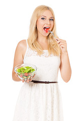 Image showing Woman eating fresh salad