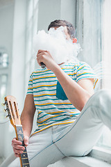 Image showing The face of vaping young man