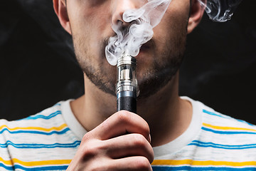 Image showing The face of vaping young man