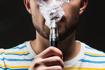 Image showing The face of vaping young man