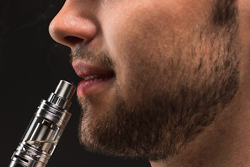 Image showing The face of vaping young man