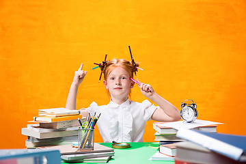 Image showing Teen girl with lot of books