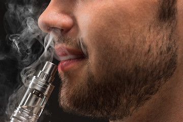 Image showing The face of vaping young man