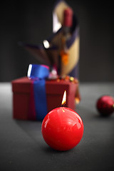 Image showing Red candle, festive atmosphere in the house