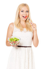 Image showing Woman eating fresh salad