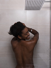 Image showing African American woman in the shower