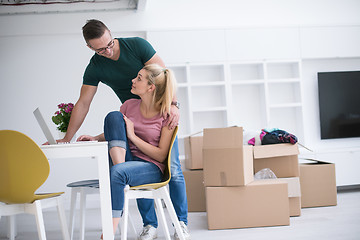 Image showing Young couple moving in a new home