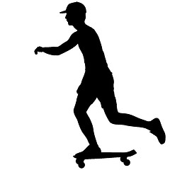 Image showing Silhouettes skateboarder performs jumping on a white background