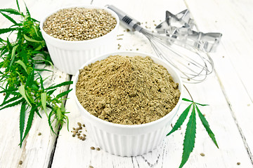 Image showing Flour hemp and grain in bowls with leaf on light board