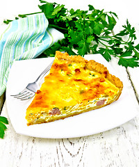 Image showing Quiche with pumpkin and bacon in white plate on board