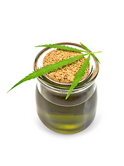 Image showing Oil hemp in glass jar with leaf on lid