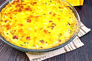 Image showing Quiche with pumpkin and bacon in pan on board