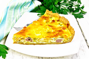 Image showing Quiche with pumpkin and bacon in white plate on light board