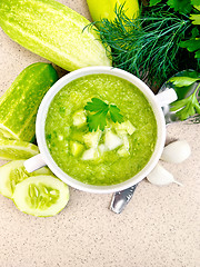 Image showing Soup cucumber in white bowl on granite table top