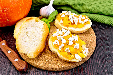 Image showing Bruschetta with pumpkin and garlic on board