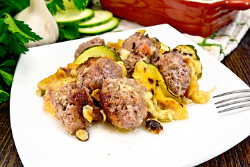 Image showing Meatballs with cheese and squash in plate on board