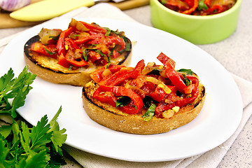 Image showing Bruschetta with tomatoes and peppers in plate on table