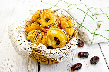 Image showing Cookies with dates in wicker basket on light board