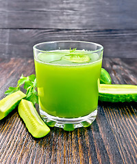 Image showing Juice cucumber in glassful on dark board