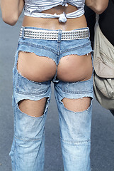 Image showing ass in hole of jeans