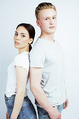 Image showing young pretty teenage couple, hipster guy with his girlfriend happy smiling and hugging isolated on white background, lifestyle people concept 