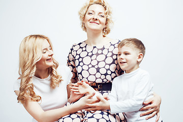 Image showing happy smiling family together posing cheerful on white background, lifestyle people concept, mother with son and teenage daughter isolated