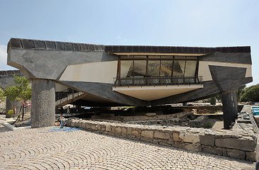 Image showing Modern Memorial over old octagonal church