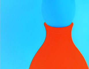 Image showing Orange Vase On A Blue Background