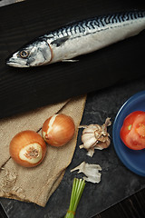 Image showing Mackerel and vegetables on a wooden table