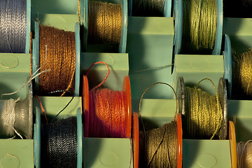 Image showing  thread on  tailor bobbins