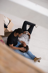 Image showing African American couple relaxing in new house