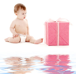 Image showing baby boy in diaper with big gift box