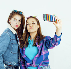 Image showing best friends teenage girls together having fun, posing emotional on white background, besties happy smiling, lifestyle people concept close up