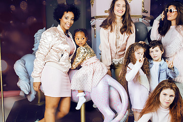 Image showing Lifestyle and people concept: young pretty diversity nations woman with different age children celebrating on birth day party together happy smiling, making selfie. African-american, asian and caucasi