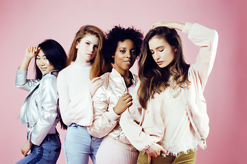 Image showing different nation girls with diversuty in skin, hair. Asian, scandinavian, african american cheerful emotional posing on pink background, woman day celebration, lifestyle people concept closeup