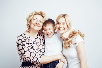 Image showing happy smiling family together posing cheerful on white background, lifestyle people concept, mother with son and teenage daughter isolated