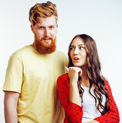 Image showing young pretty teenage couple, hipster guy with his girlfriend happy smiling and hugging isolated on white background, lifestyle people concept 