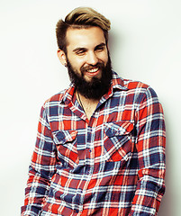 Image showing portrait of young bearded hipster guy smiling on white background close up, brutal modern man