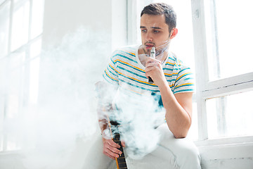 Image showing The face of vaping young man