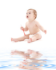 Image showing baby boy in diaper with toothbrush