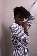 Image showing beautiful black woman wearing  bathrobe