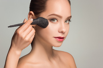 Image showing Beautiful female eyes with make-up and brush