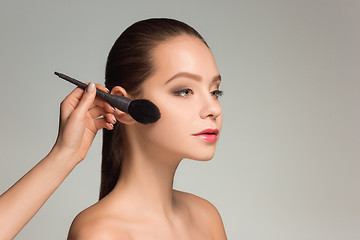 Image showing Beautiful female eyes with make-up and brush